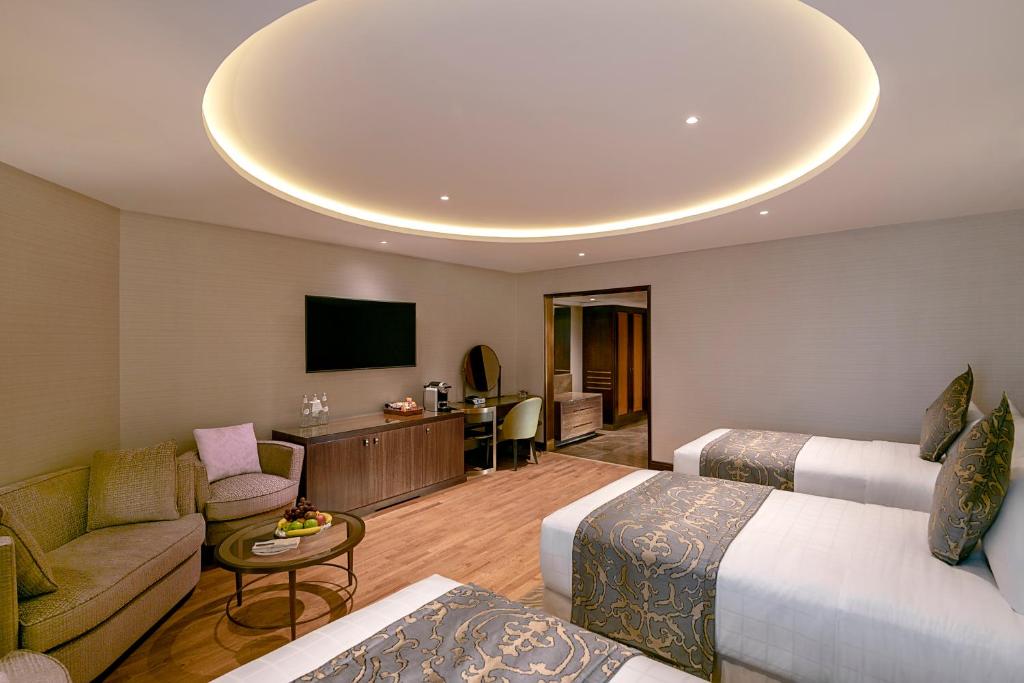 InterContinental Dar al Iman Madinah - Deluxe hotel room interior near Masjid Nabawi, Islamic heritage accommodation amenities